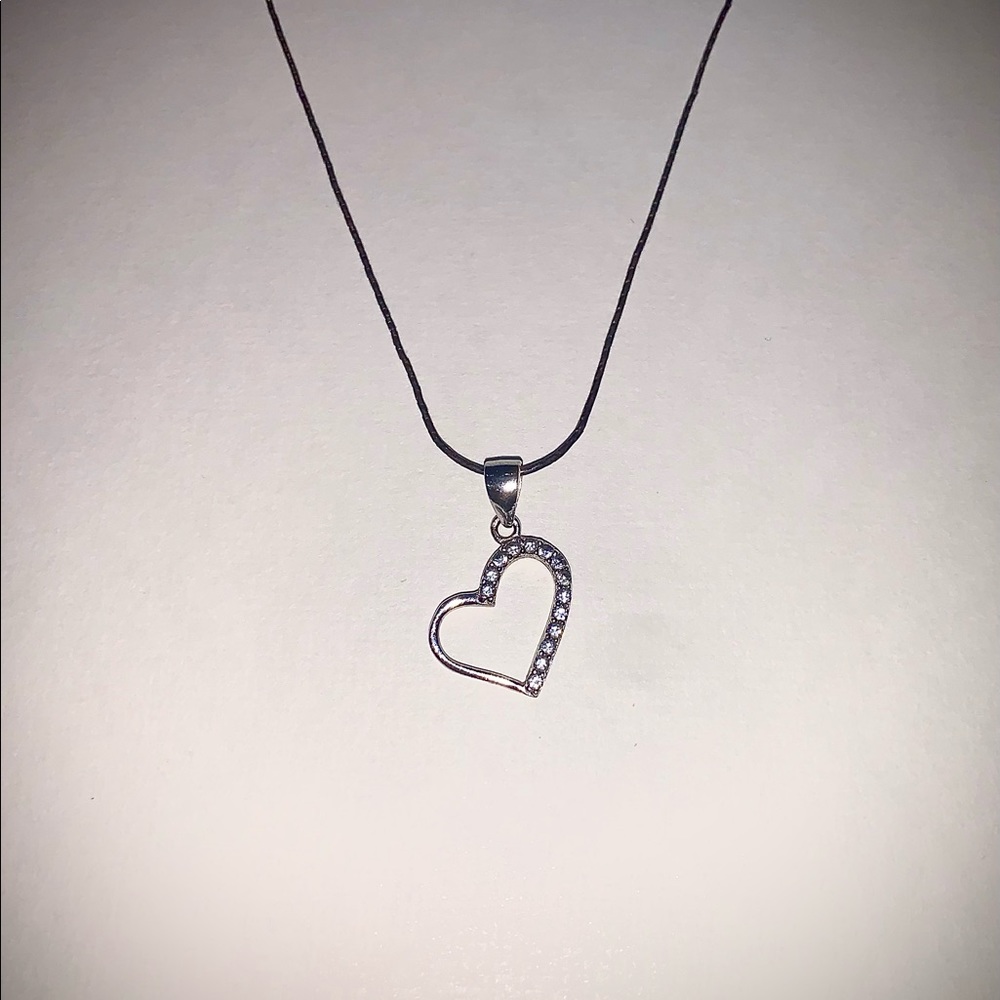 Silver Rhodium Plated Pendant Necklace decorated w/Clear Man made Cubic Zirconia
